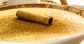 Sweet corn or pudding called Curau, jimbelÃÂª or hominy, decorated with cinnamon in bark in cinnamon powder