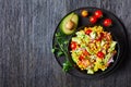 Sweet corn salad with avocado, top view Royalty Free Stock Photo