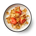 Sweet cornflakes with milk and strawberries