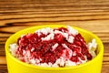 Sweet cottage cheese dessert with raspberry jam in ceramic bowl on wooden table, close-up view Royalty Free Stock Photo