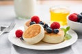 Sweet cottage cheese fritters with berries