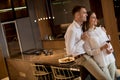 Sweet couple having drinking red wine after a romantic dinner at luxury kitchen Royalty Free Stock Photo