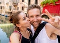 Sweet couple in love taking a selfie in Venice Italy while traveling around europe Royalty Free Stock Photo