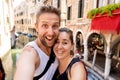 Sweet couple in love taking a selfie in Venice Italy while traveling around europe Royalty Free Stock Photo