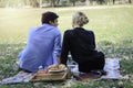 Sweet couple relaxing on picnic in park young beautiful lover spending time together and having romantic moment in summer garden