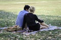 Sweet couple relaxing on picnic in park young beautiful lover spending time together and having romantic moment in summer garden