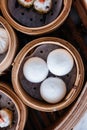 Sweet cream buns served in steamer baskets with many kind of Dim sum Royalty Free Stock Photo