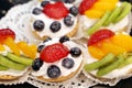 Creamy cakes with fresh fruits and berries Royalty Free Stock Photo