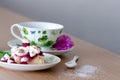 Sweet berry cake with cup of tea on wooden table Royalty Free Stock Photo