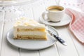 Sweet creamy cake on plate on white table Royalty Free Stock Photo