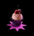 Sweet Creamy Cupcake with Topping isolated on the black background Royalty Free Stock Photo