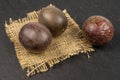 Sweet dark passion fruit on grey stone Royalty Free Stock Photo