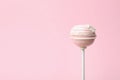 Sweet decorated cake pop on pink, space for text