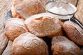 Sweet deep-fried Bunuelos sprinkled with powdered sugar close-up. horizontal