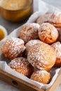 Sweet deep fried small homemade balls donuts on a platter