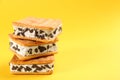 Sweet delicious ice cream cookie sandwiches on background, closeup. Space for text Royalty Free Stock Photo