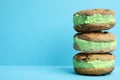 Sweet delicious ice cream cookie sandwiches on color background Royalty Free Stock Photo