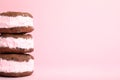 Sweet delicious ice cream cookie sandwiches on color background Royalty Free Stock Photo