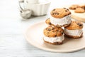 Sweet delicious ice cream cookie sandwiches on white table. Space for text Royalty Free Stock Photo