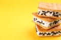 Sweet delicious ice cream cookie sandwiches on background, closeup. Space for text Royalty Free Stock Photo