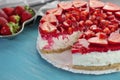 Sweet delicious strawberry cake on wooden background