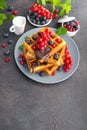 Sweet dessert belgian waffles with chocolate, blueberry and red currant Royalty Free Stock Photo