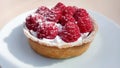 Sweet dessert with fresh raspberry and cream