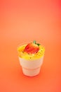Sweet dessert in glass with biscuit, Strawberries fruit and whipped cream. Empty space for text on an orange background Royalty Free Stock Photo