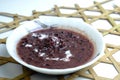 Sweet dessert in Malaysia and Indonesia, call bubur pulut hitam on white plate