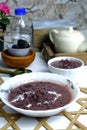 Sweet dessert in Malaysia and Indonesia, call bubur pulut hitam on white plate