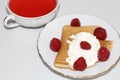 Sweet dessert: pancake with cream and strawberries