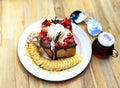 Sweet Dessert, Strawberry nutella chocolate honey toast with vanilla ice cream, sliced bananas and strawberries added topping whip Royalty Free Stock Photo