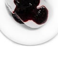 Plate of white ice cream drenched jam. Royalty Free Stock Photo