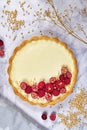 Sweet dessert tart with cheesecake cream filling topped with red raspberry  and cranberry fruits Royalty Free Stock Photo