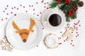 Christmas dish featuring a deer with cup coffe. View from above.