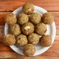 Sweet Dink laddu also known as Dinkache ladoo or gond ke laddoo made using edible gum with dry fruits.served over a white plate on