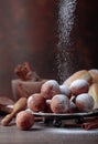 Sweet donuts with cinnamon sticks powdered with sugar. Royalty Free Stock Photo