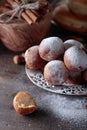 Sweet donuts with cinnamon sticks powdered with sugar. Royalty Free Stock Photo