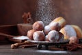 Sweet donuts with cinnamon sticks powdered with sugar. Royalty Free Stock Photo