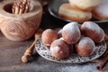 Sweet donuts with cinnamon sticks powdered with sugar. Royalty Free Stock Photo