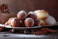 Sweet donuts with cinnamon sticks powdered with sugar. Royalty Free Stock Photo