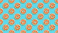 Sweet donuts.Colorful glazed pastries seamless background. Orange caramel toppings bakery with decorations top view Royalty Free Stock Photo