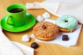 Sweet donuts and cup of black coffee Royalty Free Stock Photo