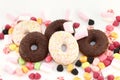 Sweet donuts, many bright candies and marshmallows