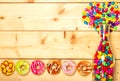 Sweet donuts pastel color on wooden background