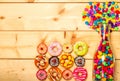 Sweet donuts pastel color on wooden background