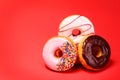 Sweet donuts on red Royalty Free Stock Photo