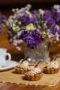 Sweet dough baskets with berries and caramel cream