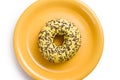 Sweet doughnut on yellow plate