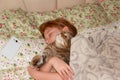 Sweet dream with a pet in an embrace Royalty Free Stock Photo